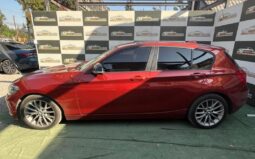 BMW 118I naranjo 2018 lleno